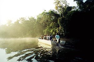 Boating on Elevala River. Copyright Bret Whitney.