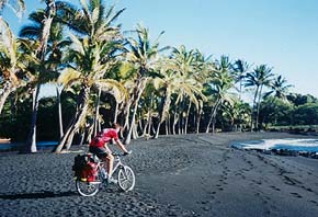 Riding a black sand beach. � Micha Pringle