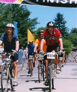 Crossing the finish line. Copyright Marathon Photo. 