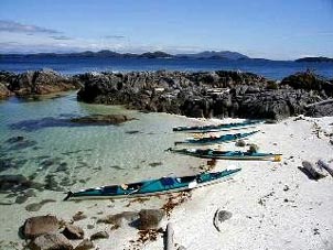 A tranquil beach begs to be explored on foot. Copyright Rick Hudson.