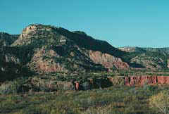 Red rock bluffs on the flanks of Palo Duro Canyon. Copyright: Kathryn Means, 1999