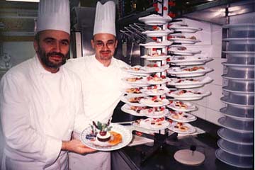 Chef Renato Piccolotto, left, and one of his talented pastry chefs show off a favorite dessert. © Sharon Lloyd Spence and Diana Schuster.