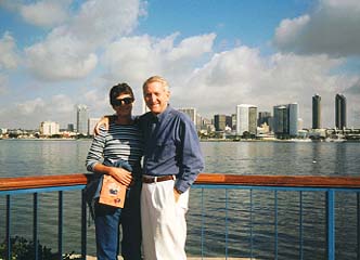 The Practical Traveler and his wife, Susan, at the Coronado Ferry Landing with the San Diego skyline in the background � Howard Hian