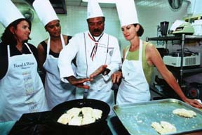 Chef Ming�s students crowd around him with intent interest. Copyright Warren Lieb.