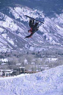 A snowboarder boosts out of the halfpipe at Buttermilk. Copyright: Rob Gracie.