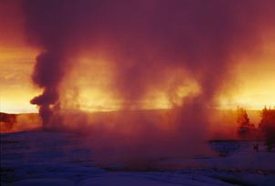 A sunrise seen through the mist of a hot spring. Copyright: Warren Lieb.