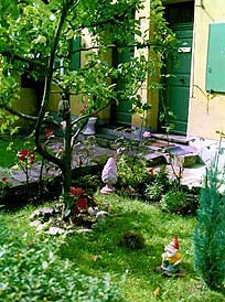 A gnome stands guard over a courtyard in the 17th century Fuggerei, the world�s oldest �social settlement.� Copyright: Jim Johnson.