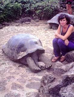Author Sharon Lloyd Spence visits a 100-year-old Galapagos Tortoise. Copyright: Sharon Lloyd Spence,1999.