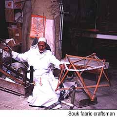 Souk fabric craftsman, Morocco. �Paris Permenter and John Bigley
