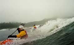 Surfers and Kayakers catching the big one. � Tristan Crees