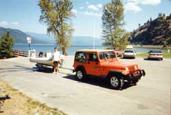 Setting out to adventure in the little white boat. Copyright: Brian Southby, 1999.